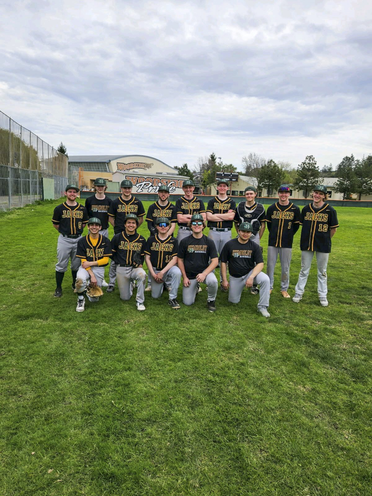Team photo of the Baseball club in uniform on the field.