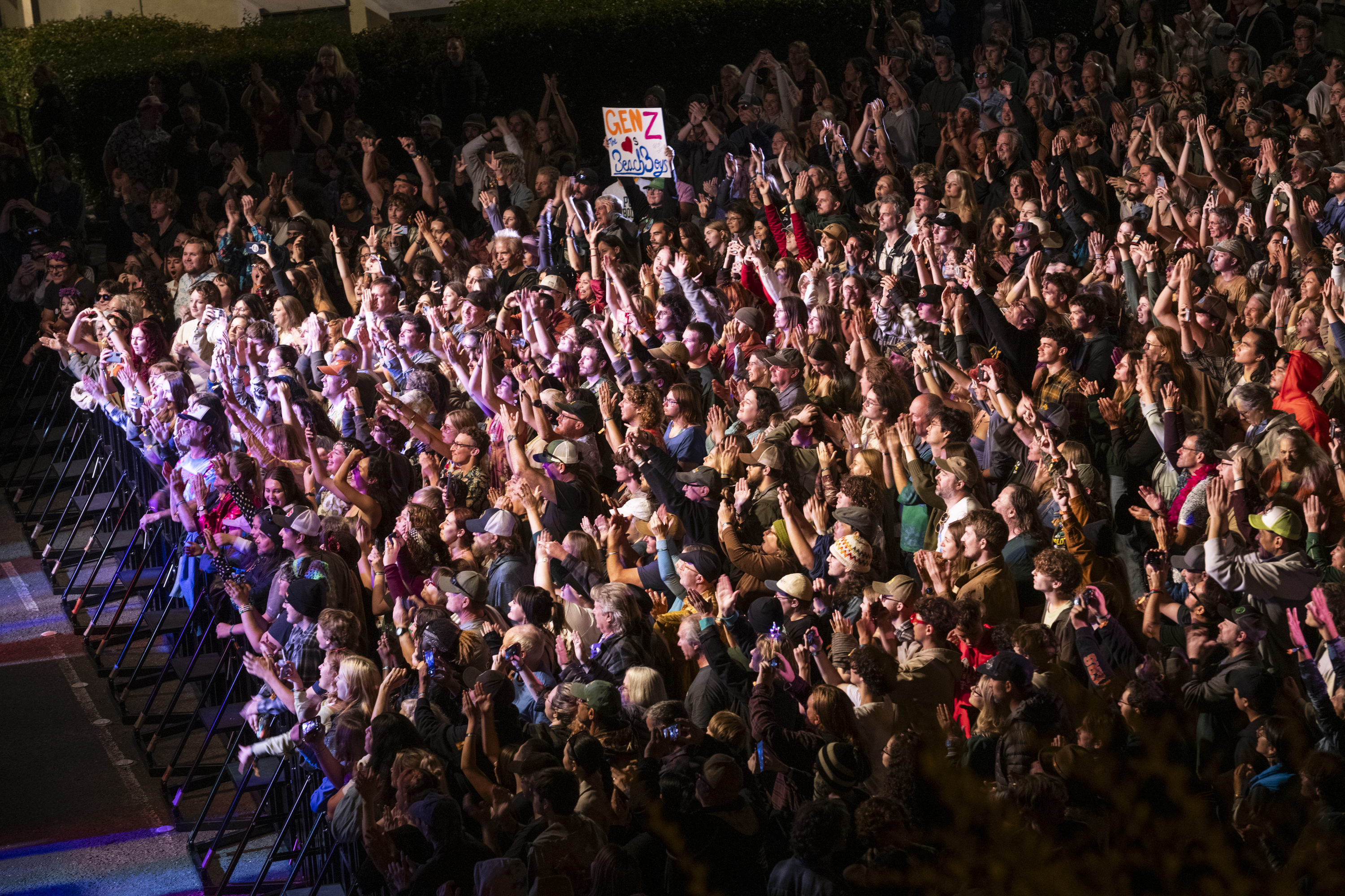 A huge crowd looking toward the stage with hundreds of people.