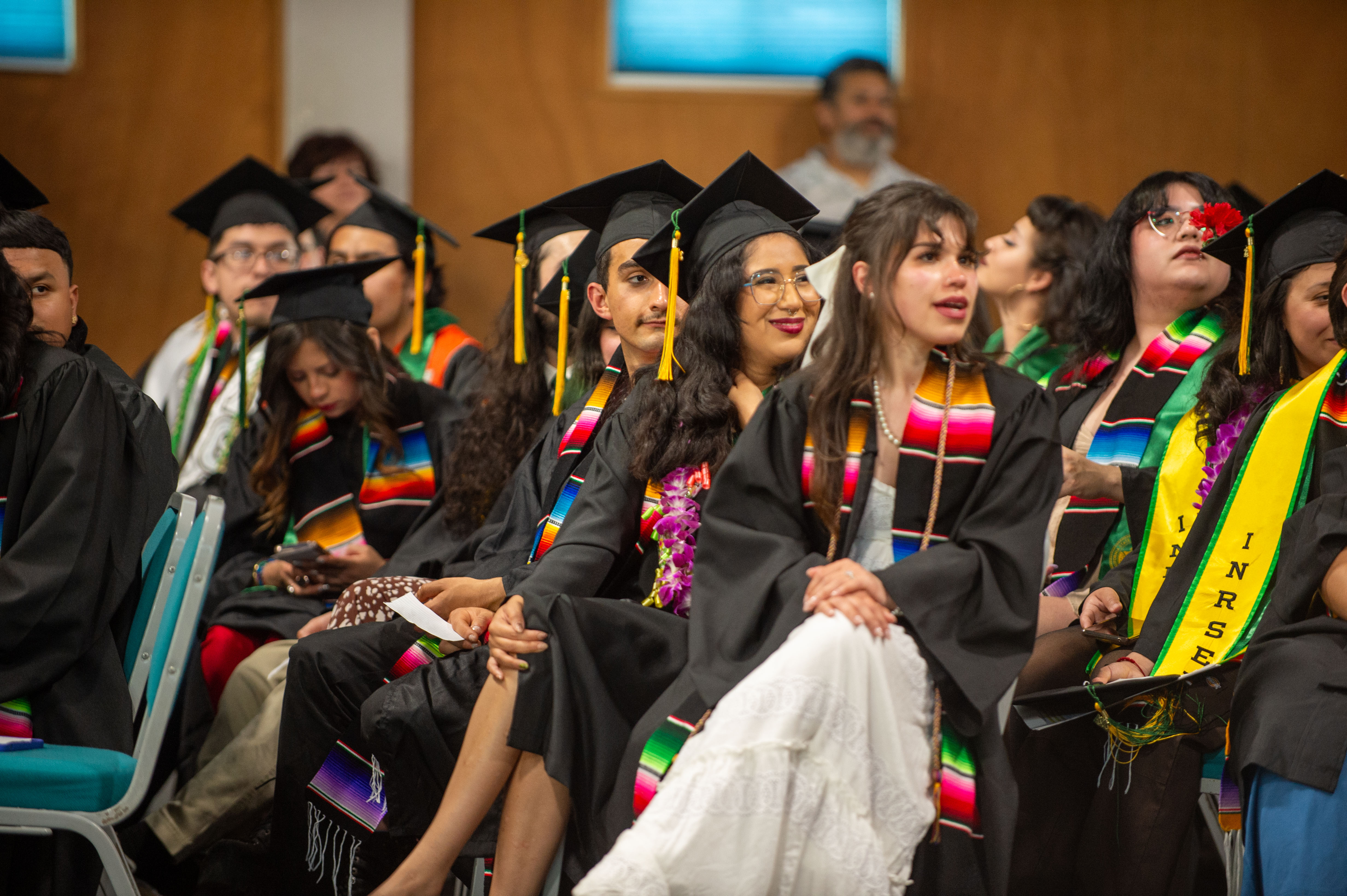 A group of graduates with El Centro grad sashes on. 