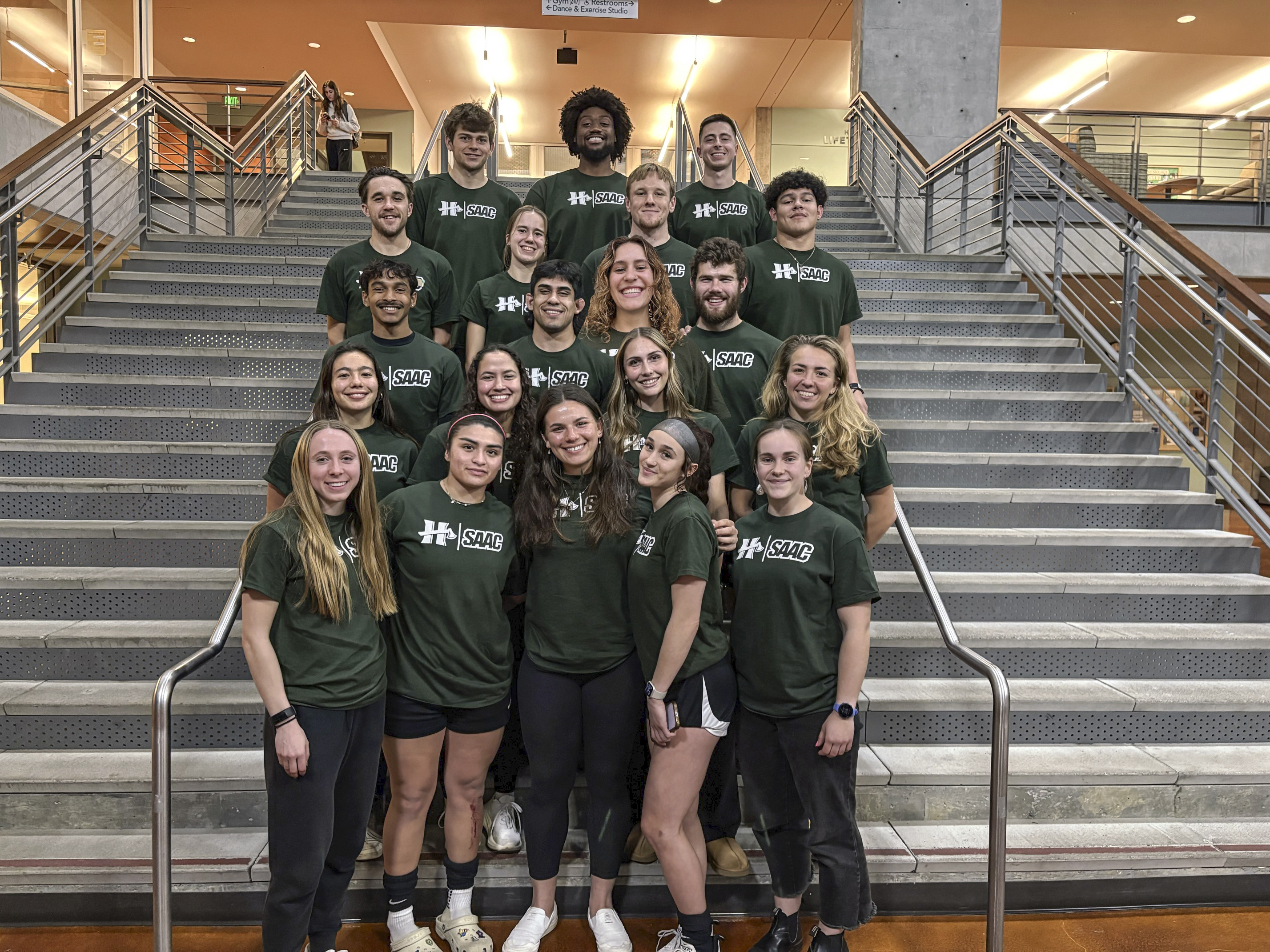 Student Athlete Advisory Club on the stairs in Lumberjack Arena.