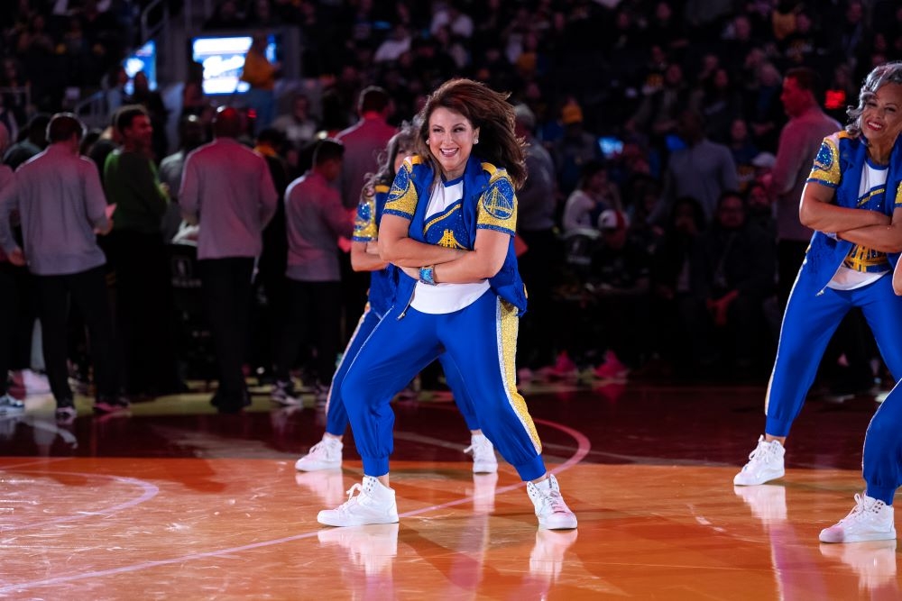 Liz Pimentel Chase Center A photo of Liz Pimentel dancing at Chase Center for the Golden State Warriors Hardwood Classics dance team.
