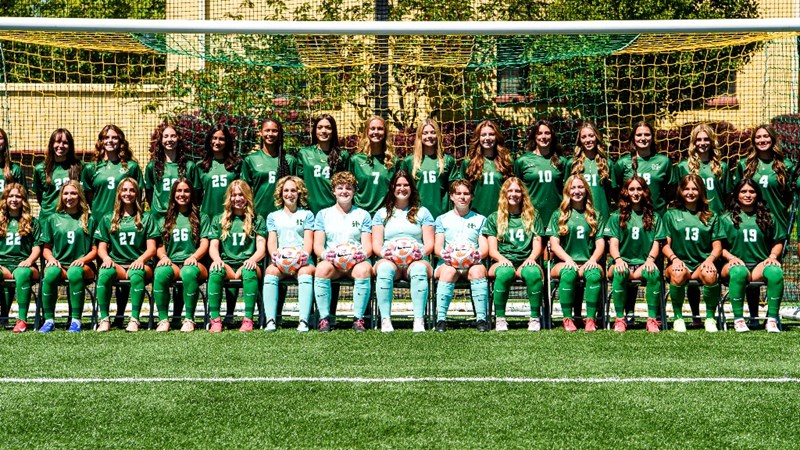 Team photo of Humboldt women's soccer in their uniforms on their field.